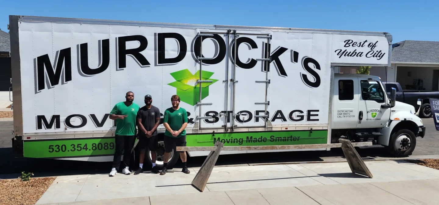 Murdock’s moving crew beside a branded truck in Yuba City